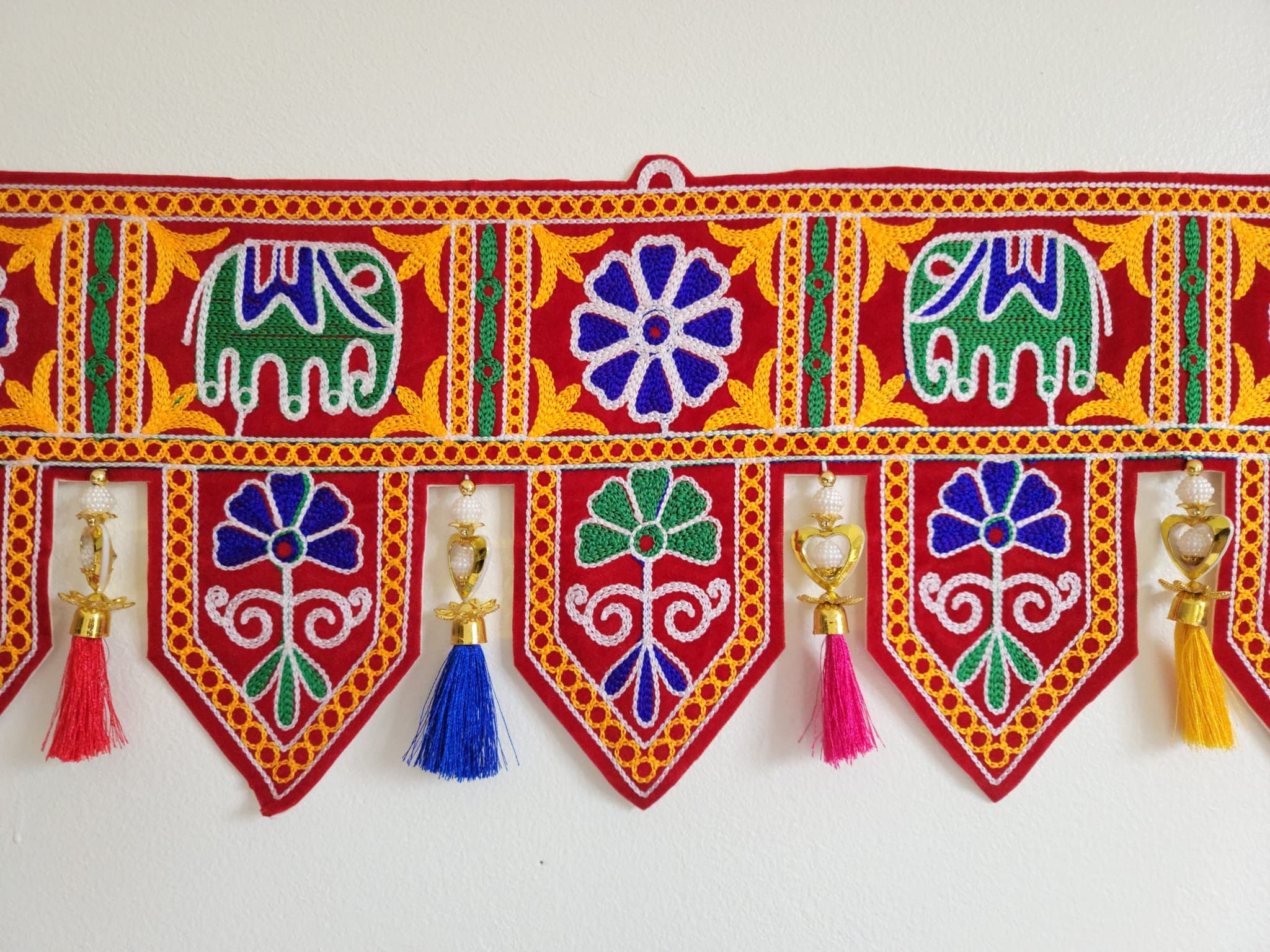 Bohemian elephant home decoration with colorful silk tassels, embroidered gypsy curtain, hippie door frame, Indian handmade ethnic tapestry. Great gift and decor for Diwali, house warming and auspicious events