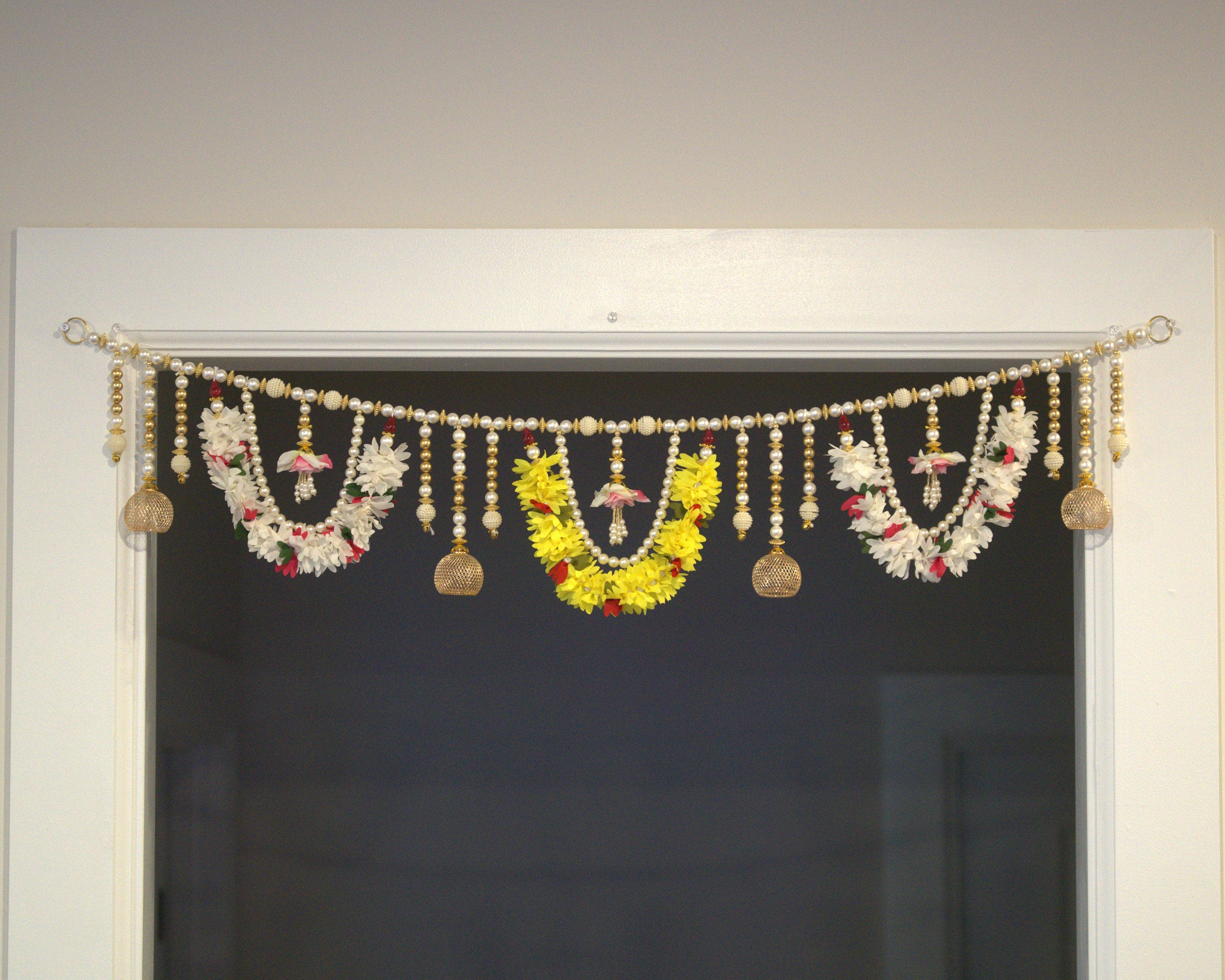 Beautiful pearl bead and golden bead toran made with cloths instead of plastic. Tea light candles can be attached to the golden dangles