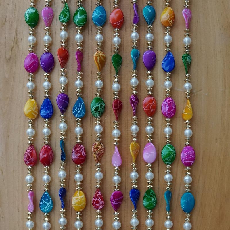 photobooth party colorful beaded backdrop.