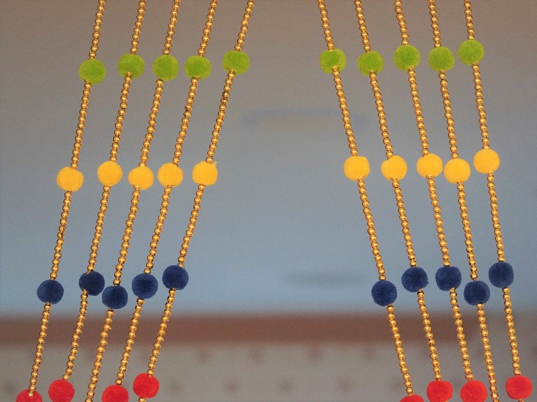 handmade woolen pompom garlands for party backdrop.
