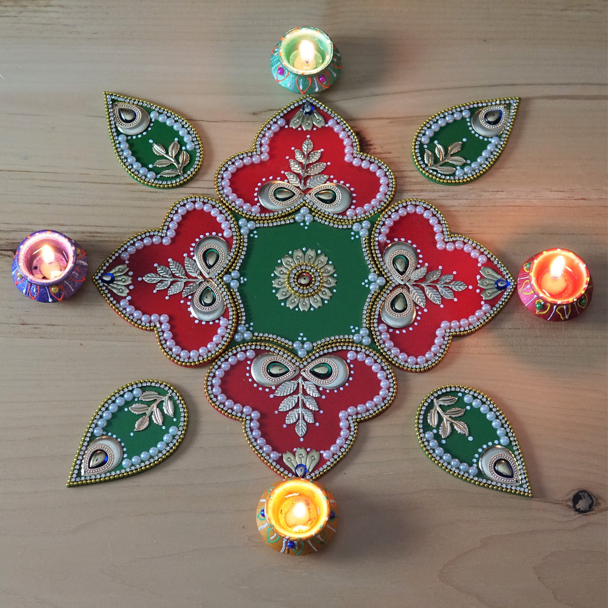 Red and Green Rangoli Set - 9 Pieces with 4 Wax Diyas - arrangement 3
