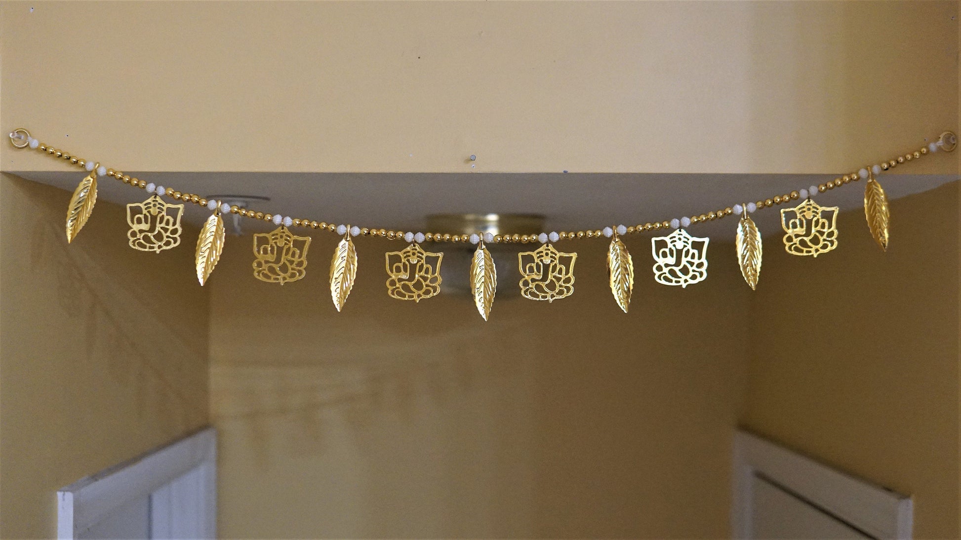 Golden Ganesha toran for home decoration, Diwali, house warming, and auspicious events