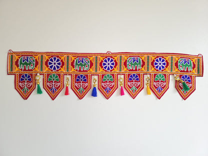 Bohemian elephant home decoration with colorful silk tassels, embroidered gypsy curtain, hippie door frame, Indian handmade ethnic tapestry. Great gift and decor for Diwali, house warming and auspicious events