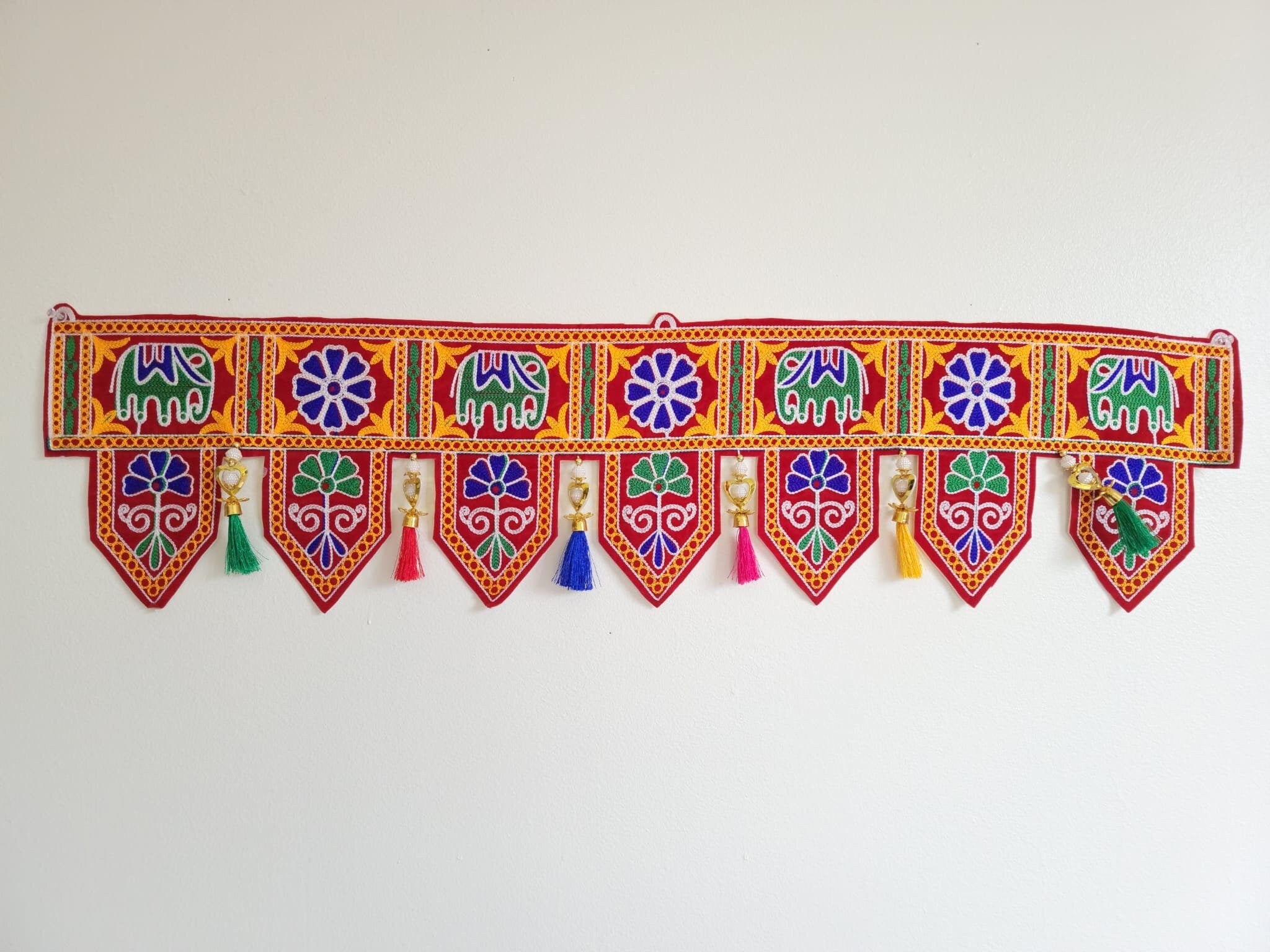 Bohemian elephant home decoration with colorful silk tassels, embroidered gypsy curtain, hippie door frame, Indian handmade ethnic tapestry. Great gift and decor for Diwali, house warming and auspicious events