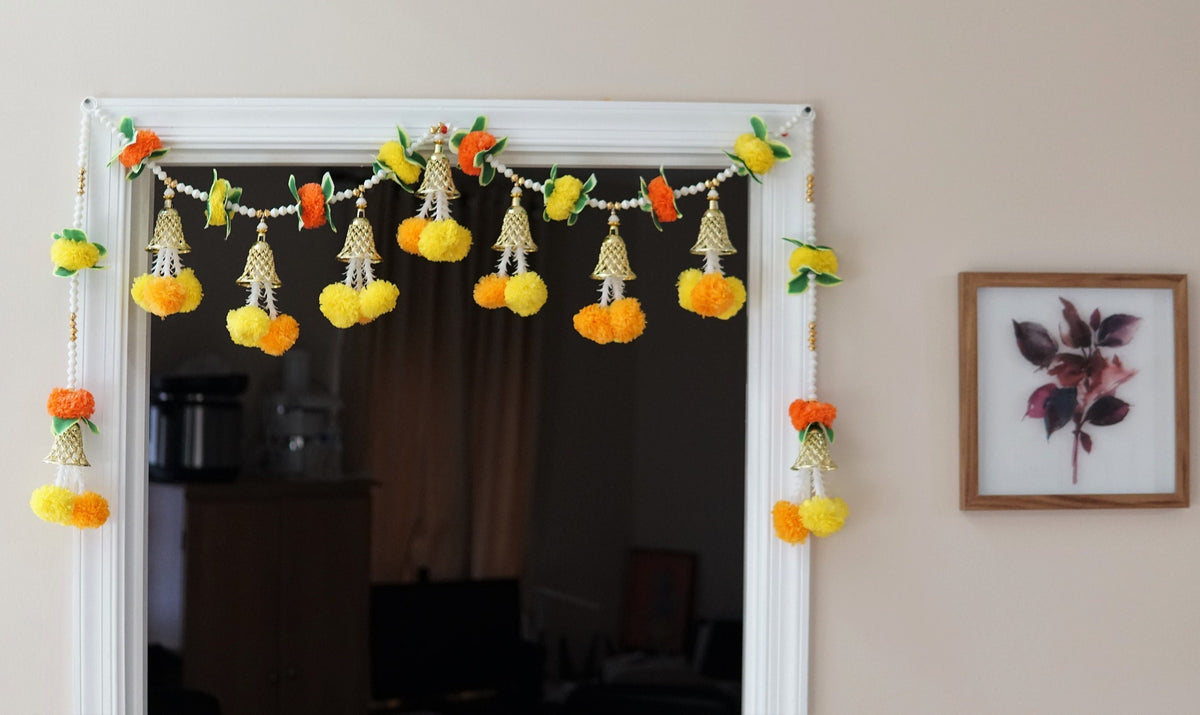 Orange and yellow pom-pom door toran with pearl-style beads, gold-tone bells and two matching side hangings
