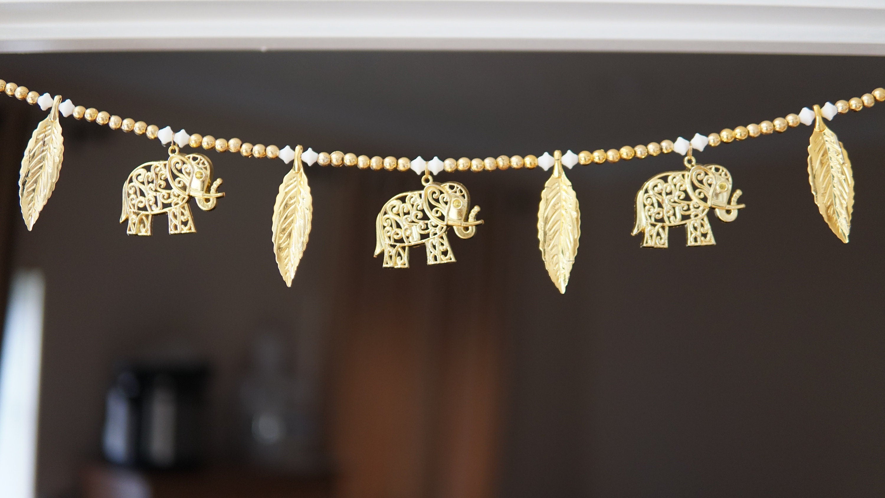 Decorative toran garland with gold elephants and leaves for ganesh puja, house warming, diwali and for boho vibes