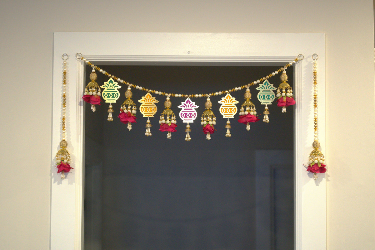 Kalash toran displayed across a doorway with two matching rose and bead side hangings