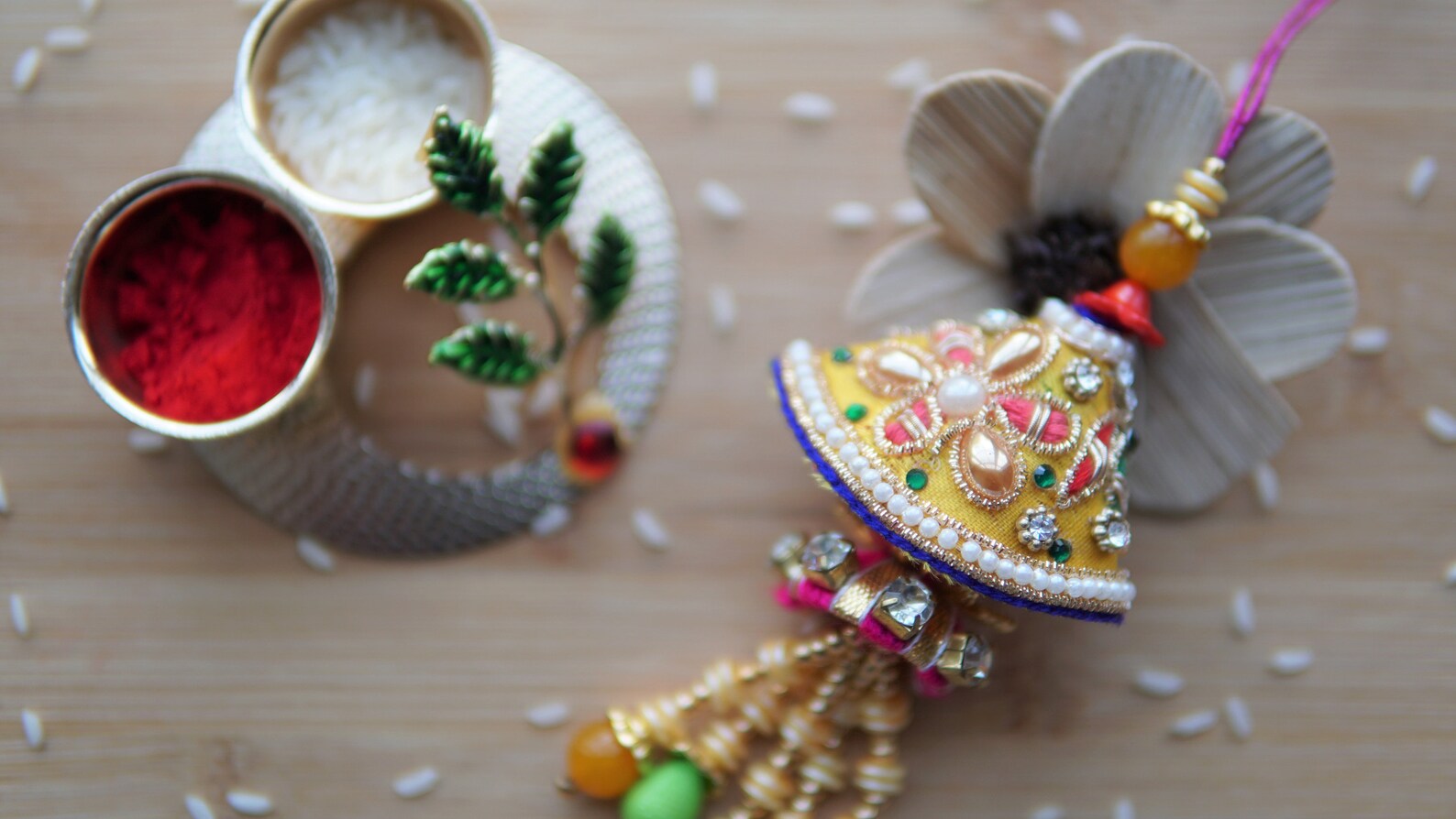 Brother and sister in law rakhi, latkan style. Made with golden beads and thread. Simple rakhi for brother and Bhabhi