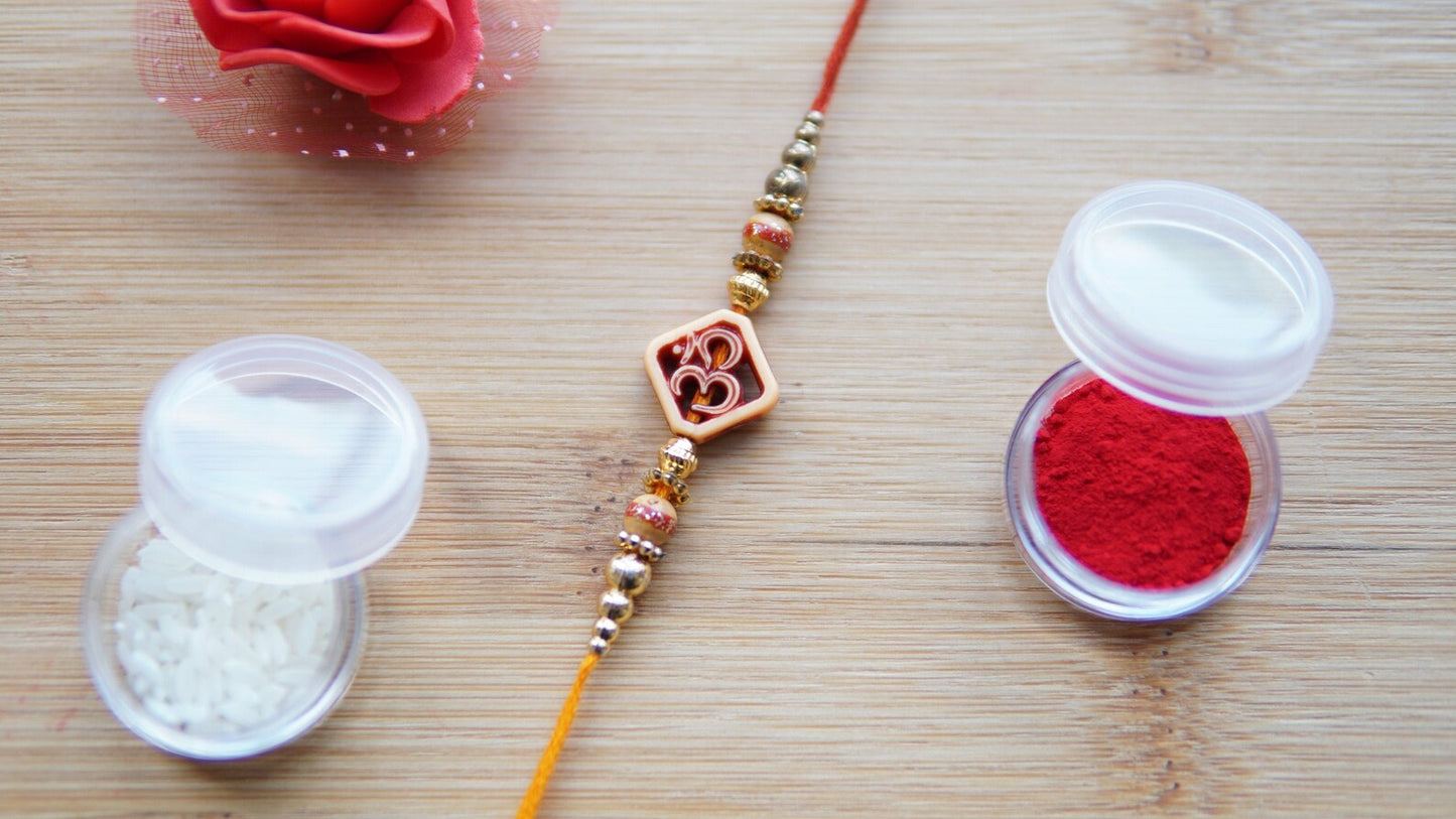 Brother rakhi with Om bead, Made with golden beads and thread. Simple rakhi for brother