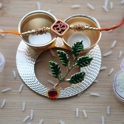 Brother rakhi with Om bead,  Made with golden beads and thread. Simple rakhi for brother