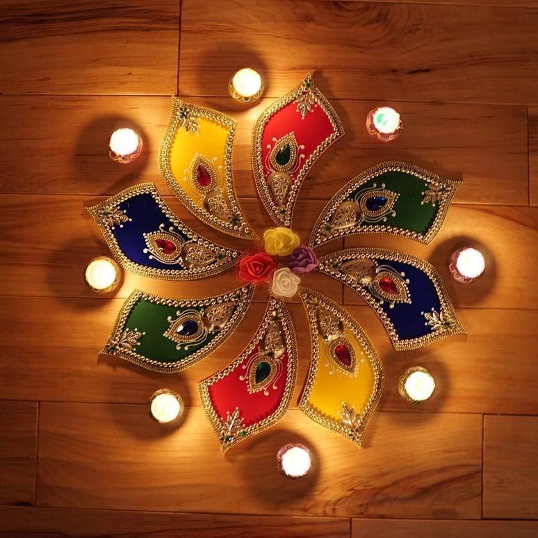 Aangan of India handcrafted rangoli tabletop decor with hand painted diya wax candles decorated with flowers. Perfect for Christmas and henna / mehndi night 